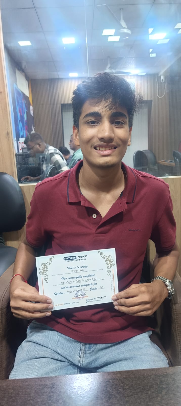 Khiren Jain holding his Future Vision certificate
