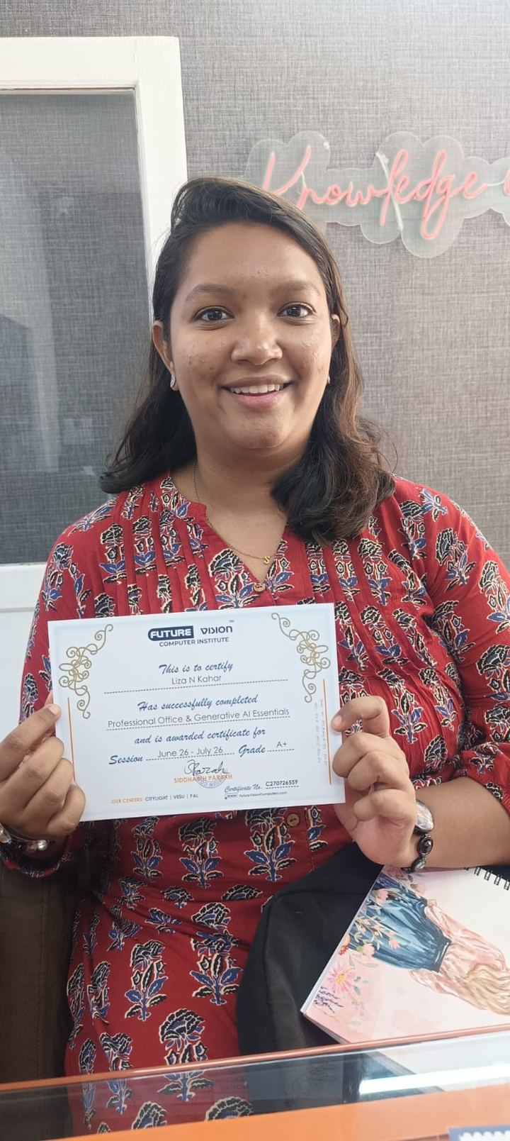 Liza Kahar holding her Future Vision certificate